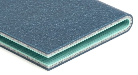 Closeup of blue and green laminated material, showcasing its layered structure, ideal for backgrounds, product design, and industrial applications, isolated on white background