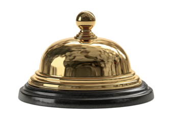 Gold desk bell on black base, isolated against black