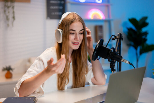Caucasian woman talking with online audience while recording video blog. - Powered by Adobe