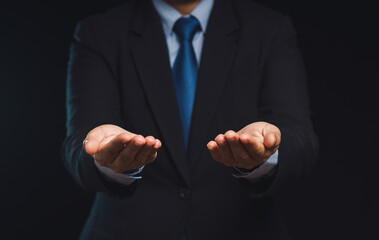 Businessman offering open hands for support concept.