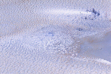 Frozen ice with pattern on a lake a cold winter day