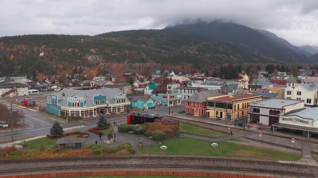 Low aerial dolly shot of the historic White Pass Yukon Route railroad station in Skagway, Alaska. 4K