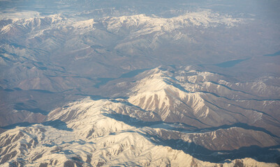 Obraz premium Plane Window View, Snow Mountains Aircraft Fly Landscape, Looking from Plane Cabin