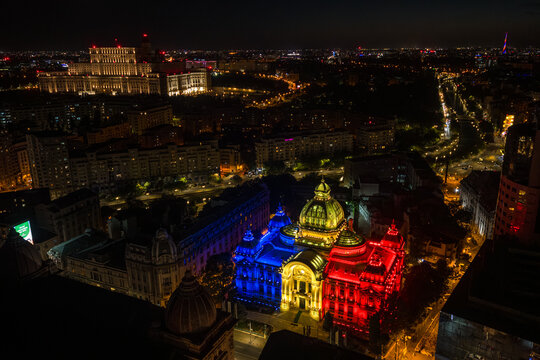 Landmarks of Bucharest. Aerial photo with CEC Palace light in the color of Romanian flag. National Day of Romania. Romanian nation concept photo. Travel to Romania.