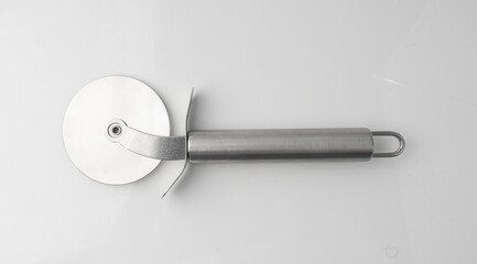 Pizza cutter isolated. Round roller knife with circle wheel, metal blade utensil