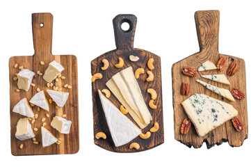 Selection of creamy Camembert soft Brie and bold Roquefort arranged with cashews pine nuts and pecans over wooden boards.