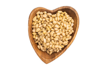 A wooden bowl filled with pale pine nuts placed on a clean white background creating a simple natural and minimal food scene perfect for stock use