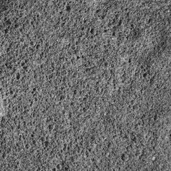 The texture of sand on the shore of a reservoir