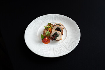 Gourmet meal elegantly presented on a white plate