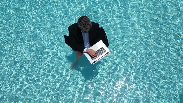 Excited business man in wet suit in sea or pool. Funny businessman, crazy comic business concept. Remote online working. Crazy hot summer business. Fun business lifestyle. Funny amazed businessman.