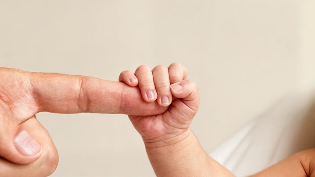 Newborn Baby Hand Gripping Parent Finger Trust Bond