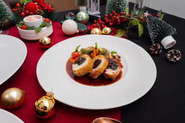 A festive Christmas dinner plate with delicious cuisine, a beautiful setting with decorations 