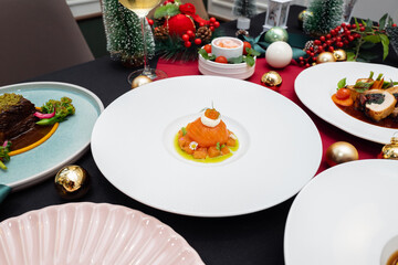 Festive Holiday Dinner Table with Gourmet Cuisine and Decorations. A beautifully set table with delicious food and Christmas decorations, showcasing a feast ready to be enjoyed.