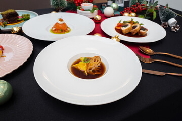 Elegant culinary presentation of multiple dishes on white plates, perfect for a fine dining experience. The dishes are meticulously arranged, showcasing the chef's expertise and attention to detail.