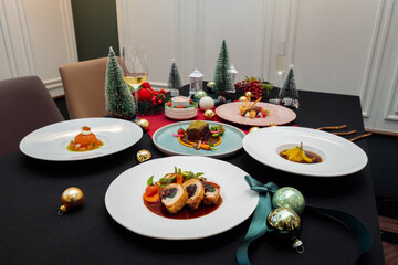 Festive Christmas table setting with delicious food and decorations