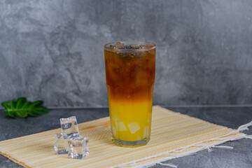 Orange tea is a refreshing blend of black tea and citrusy orange juice, sometimes with jelly cubes and basil seeds for extra texture. This vibrant drink offers a tangy, sweet, and cooling sensation.