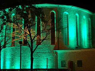 church in the night and green illuminated 