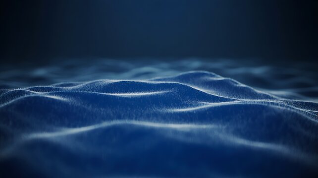 Dark blue waves forming soft flowing ocean texture
