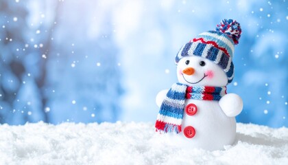 Fototapeta premium A charming snowman is standing on the snow. The snowman is wearing a hat and scarf with a smile and has a carrot nose.