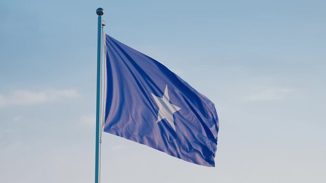 Somalia, Mogadishu: Cinematic Waving National Flag Against Blue Sky