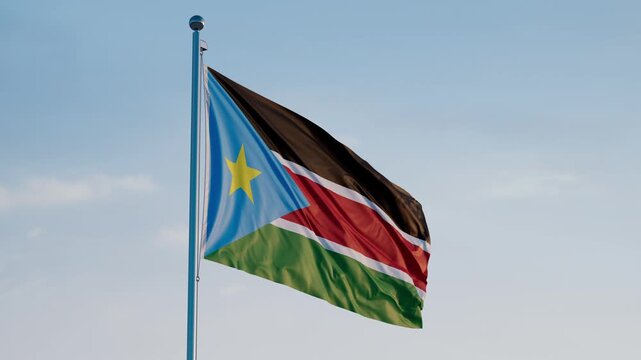 South Sudan, Juba: Cinematic Waving National Flag Against Blue Sky