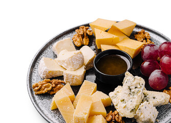 Delicious cheese platter with grapes, nuts, and honey for a perfect snack
