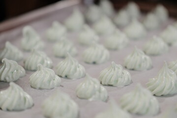 Meringue Drops Piped on Baking Sheet