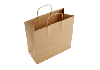 Brown paper shopping bag isolated PNG, blank kraft bag with handles for retail, merchandise, and takeaway on transparent background