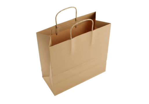 Brown paper shopping bag isolated PNG, blank kraft bag with handles for retail, merchandise, and takeaway on transparent background