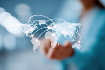 Hand holding world map showing global network connection
