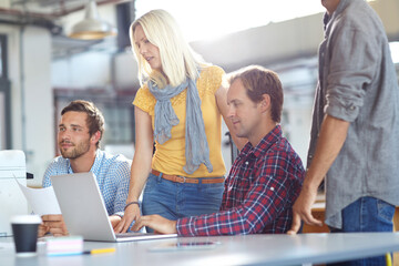 Laptop, talking and group of business people in office for news proposal, idea or document. Team, computer and journalist planning in meeting for article, creative story and collaboration in startup