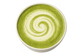 Matcha latte in a white cup forming a decorative spiral design with creamy foam, overhead view, transparent background