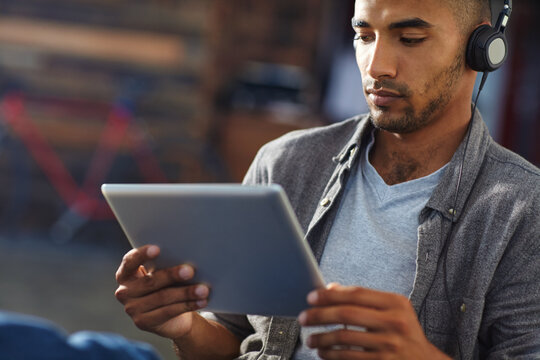 Design, streaming and tablet with game developer in office for software update or testing. App, headphones and playing with designer man in creative workplace for graphics or video calibration