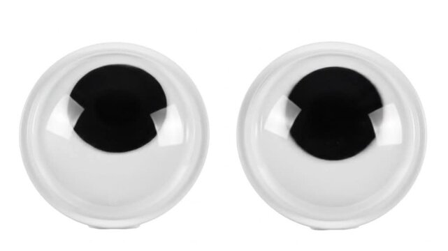 Two googly eyes isolated on white background, perfect for crafts, decorations, and adding a playful touch to any project