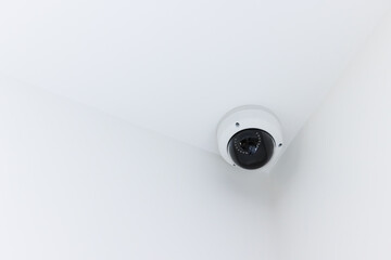 IP CCTV camera on white background with home security system concept. CCTV camera on the ceiling