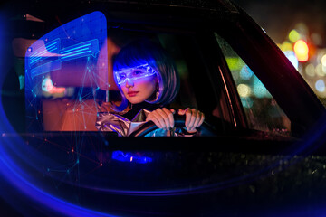 Woman in futuristic glasses driving car with holographic display.