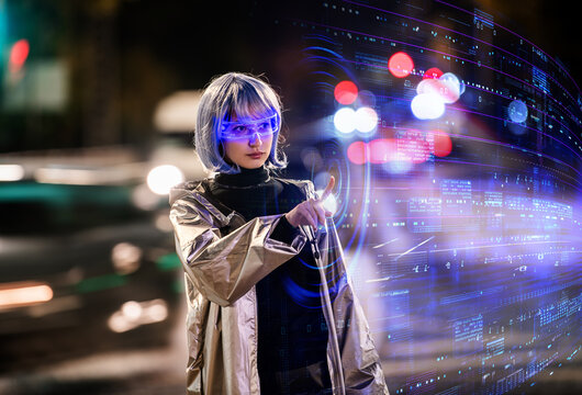 Woman with futuristic glasses interacting with virtual interface.
