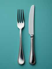 Emerald studio with plain background, with fork and knife on both sides