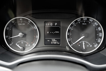 Fototapeta premium Car dashboard - close-up of the tachometer and speedometer