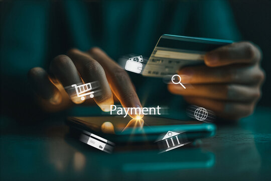 Secure mobile payment with credit card and digital finance icons glowing on screen.
