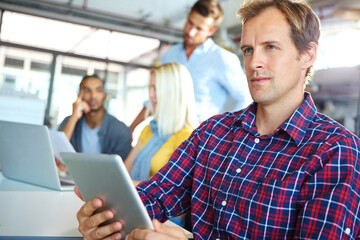 Obraz premium Media agency, tablet and man in office, thinking and internet with online engagement for startup. Person, creativity and employee in workplace, tech and email with planning, solution and website info