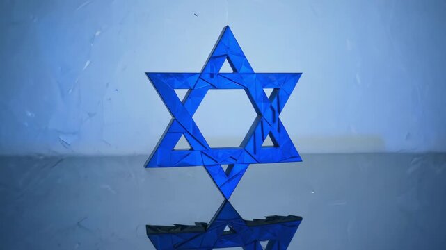 Blue Star of David with glowing light effect in the background. 4k Video footage