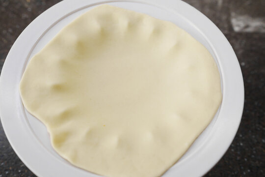 Preparing khinkali using a special tool in the kitchen