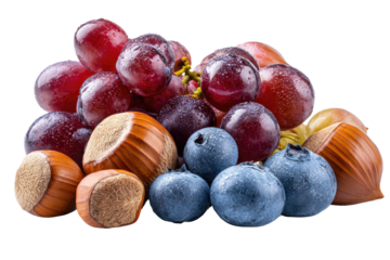 A healthy collection grapes, blueberries, and hazelnuts arranged on a black background