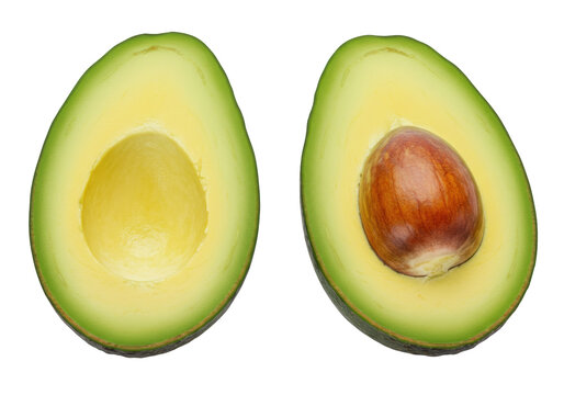 Isolated halved avocado pair, fresh and vibrant in color, showcasing the pit and creamy flesh