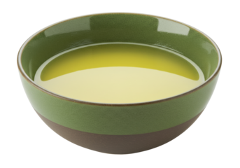Isolated green bowl with liquid is displayed on a clean surface with no distractions