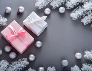 White and pink gift boxes on gray background with copy space with silver and pink glass balls and white pine branches