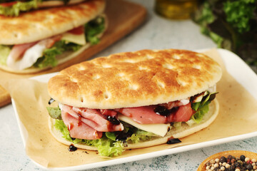 Panini sandwich with prosciutto in Italian style