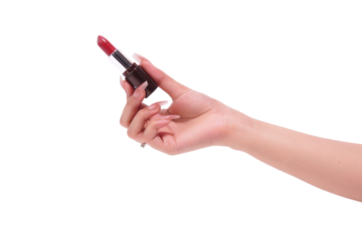 Elegant hand with long nails holding red lipstick, beauty product isolated.