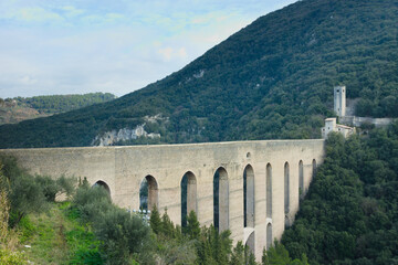 Arched bridge and aqueduct known as the  Ponte delle Torri.  Spoleto, Umbria Region, Italy.